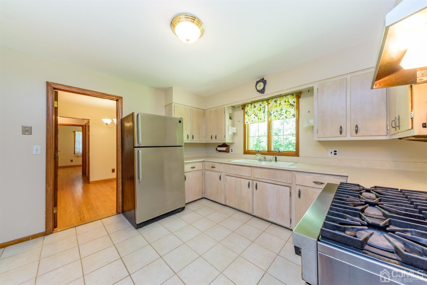 363 Rockport Road Port Murray, NJ 07865 - Photo 10 of 23 a kitchen with a refrigerator and a sink