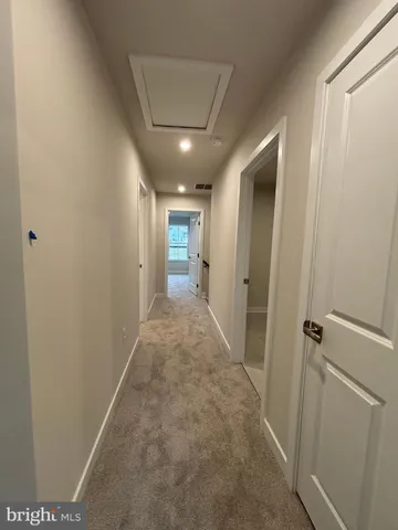 a view of hallway with livingroom