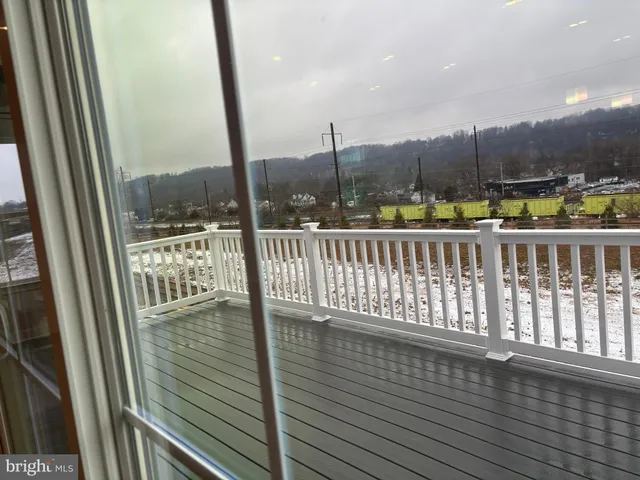 a view of balcony with furniture