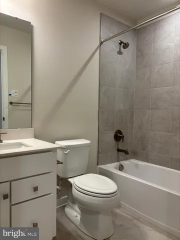 a bathroom with a sink a mirror and a toilet