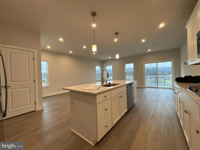 a kitchen with a stove and a sink