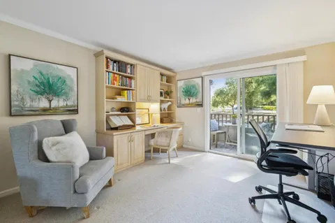 a room with furniture and a large window