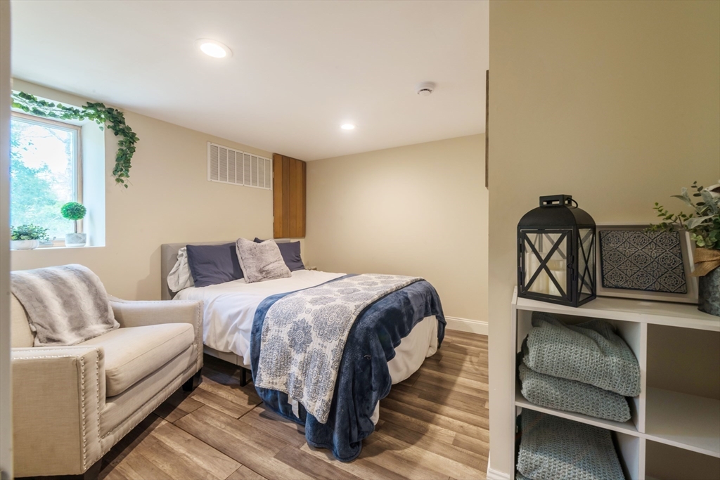 155 Great Marsh Road Centerville, MA 02632 - Photo 31 of 36 a spacious bedroom with a bed and window