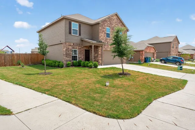a swimming pool with yard and outdoor seating