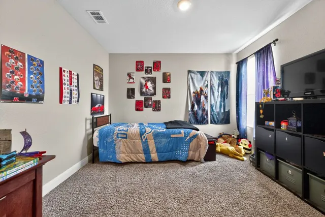 a room with furniture and a flat screen tv