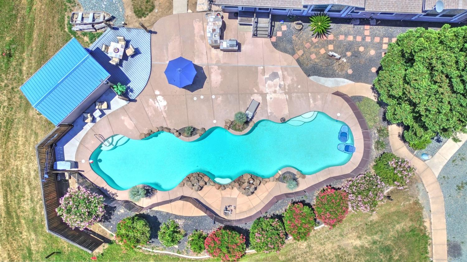 12390 Hobday Road Wilton, CA 95693 - Photo 90 of 92 an aerial view of a swimming pool patio and outdoor seating