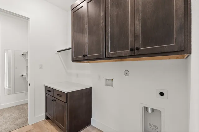 a view of a brick house with a yard