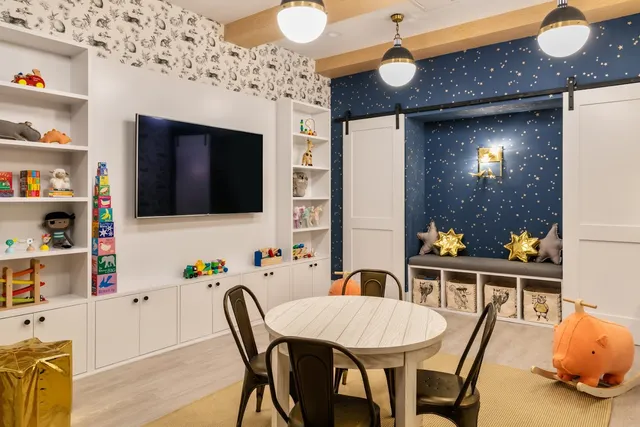 a picture of a room with a white wall and a painting