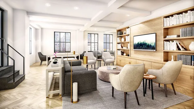 a living room with furniture fireplace and a window