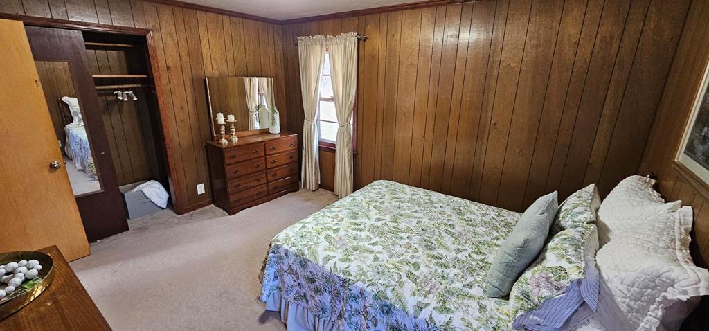 6656 Fires Creek Road Hayesville, NC 28904 - Photo 12 of 38 a bedroom with a bed and a mirror