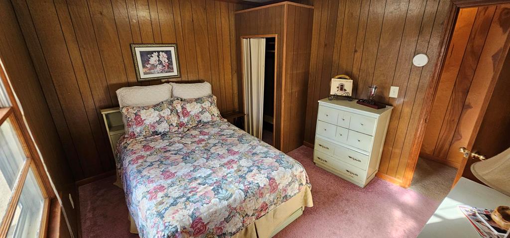 6656 Fires Creek Road Hayesville, NC 28904 - Photo 13 of 38 a bedroom with a bed and a dresser