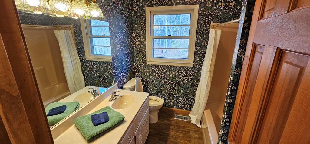 6656 Fires Creek Road Hayesville, NC 28904 - Photo 15 of 38 a view of a door and chair