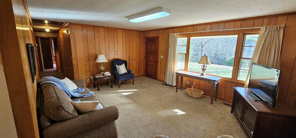 6656 Fires Creek Road Hayesville, NC 28904 - Photo 17 of 38 a view of a livingroom with furniture and windows
