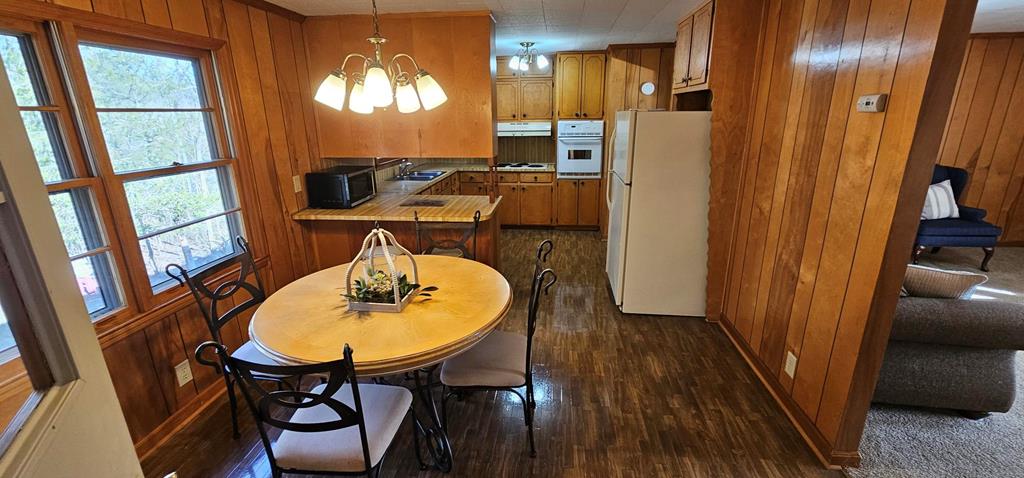 6656 Fires Creek Road Hayesville, NC 28904 - Photo 20 of 38 a dining room with furniture and window