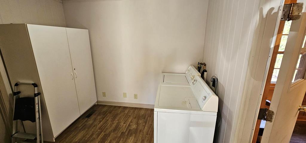 6656 Fires Creek Road Hayesville, NC 28904 - Photo 22 of 38 a view of walk in closet with wooden floor and white wall
