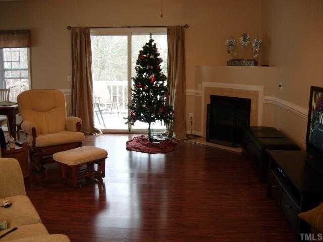 2925 Englefield Drive Raleigh, NC 27615 - Photo 2 of 11 a living room with furniture and a fireplace