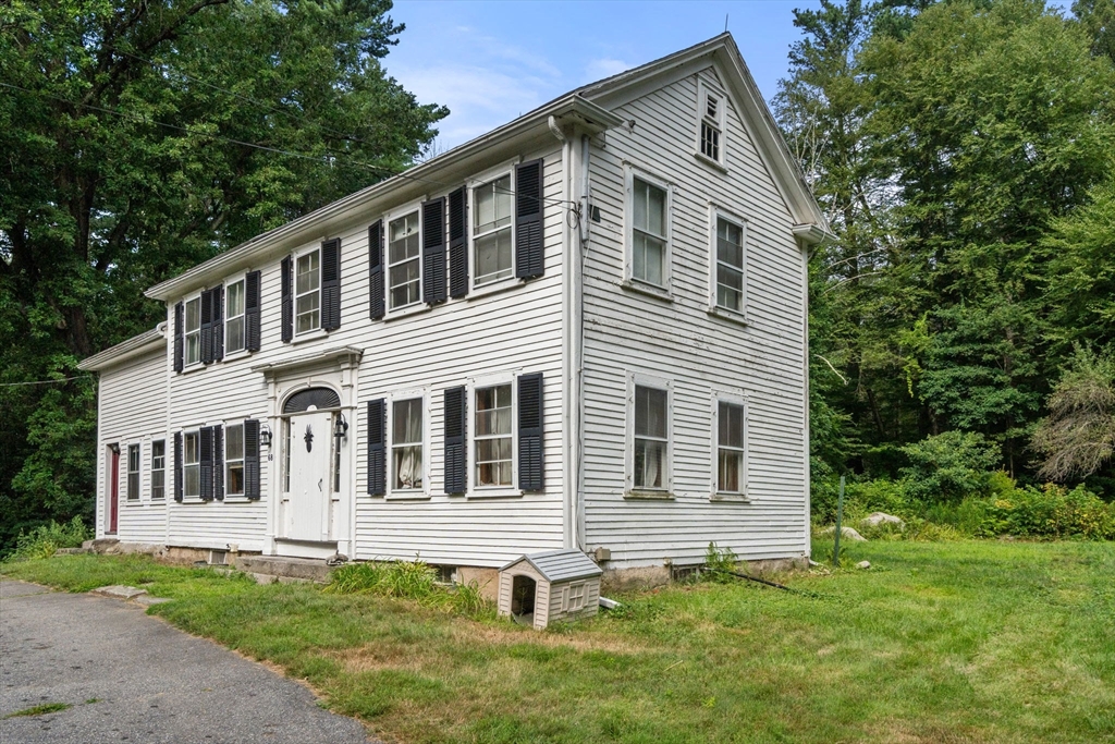 68 Spring Street Hopkinton, MA 01748 - Photo 13 of 28 a front view of a house with a yard