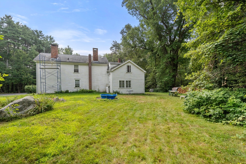 68 Spring Street Hopkinton, MA 01748 - Photo 16 of 28 a view of a house with backyard and garden