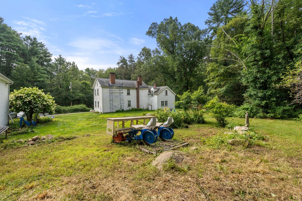 68 Spring Street Hopkinton, MA 01748 - Photo 17 of 28 a view of a house with a yard