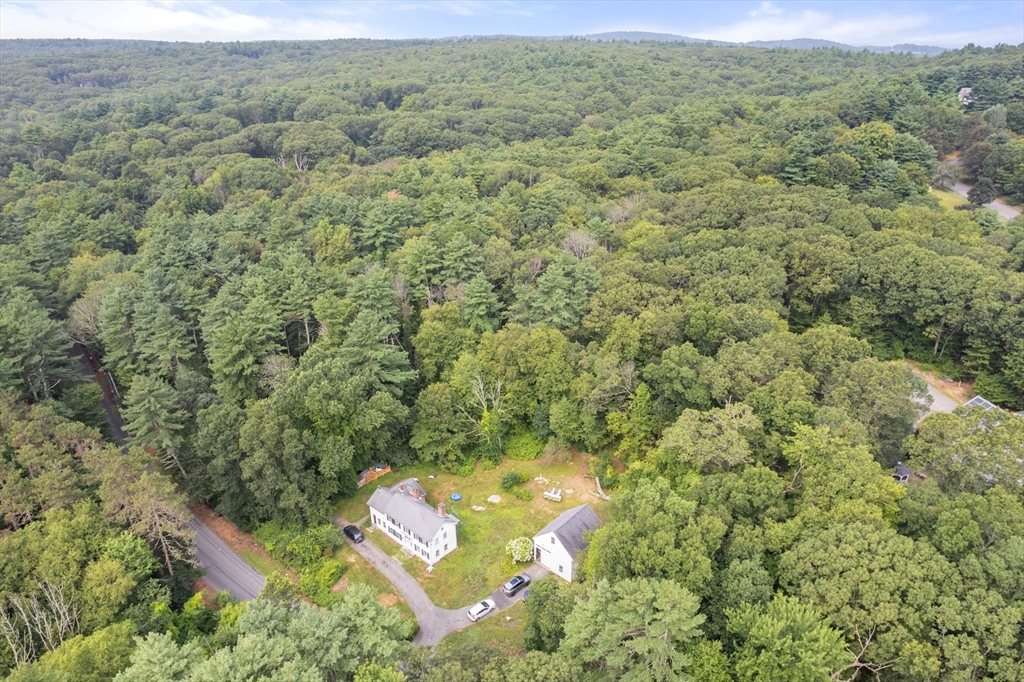 68 Spring Street Hopkinton, MA 01748 - Photo 3 of 28 an aerial view of a house with a yard