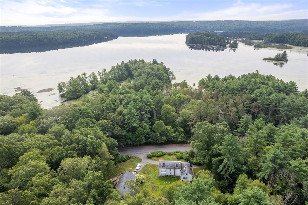 68 Spring Street Hopkinton, MA 01748 - Photo 4 of 28 a view of a lake from a yard