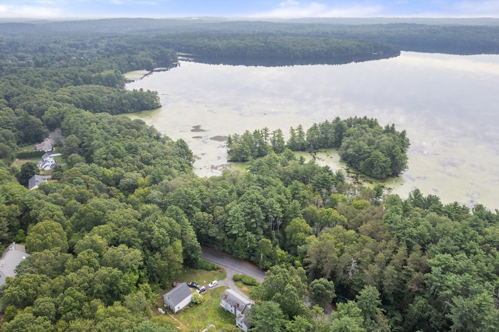 68 Spring Street Hopkinton, MA 01748 - Photo 5 of 28 a view of a lake in middle of forest