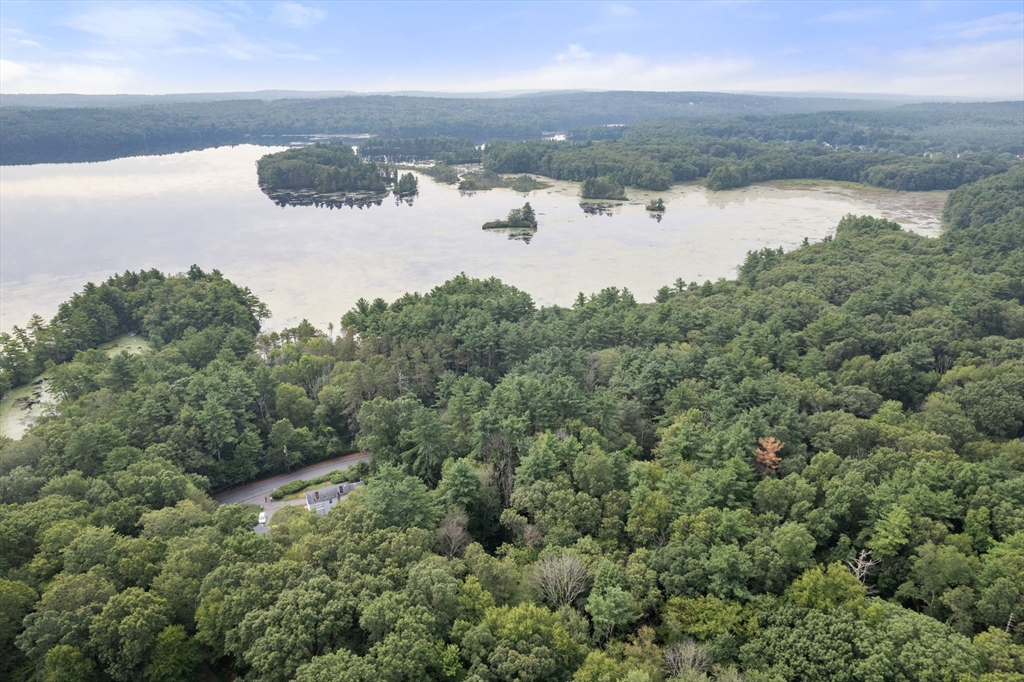 68 Spring Street Hopkinton, MA 01748 - Photo 6 of 28 a view of a lake from a yard