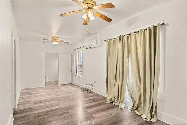 a view of a livingroom with a chandelier fan
