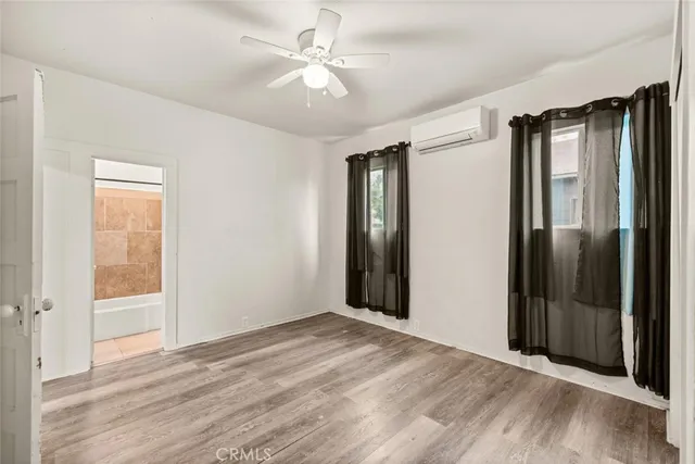 a bathroom with a tub and shower