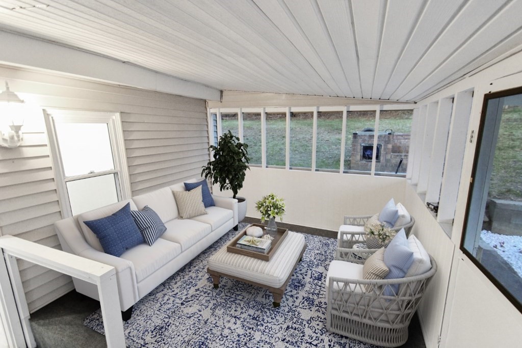 413 Mammoth Road Dracut, MA 01826 - Photo 7 of 12 a living room with furniture and a large window