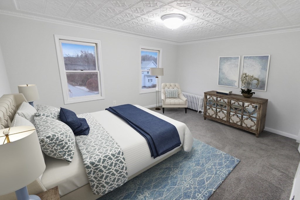 413 Mammoth Road Dracut, MA 01826 - Photo 8 of 12 a bedroom with bed couch and window