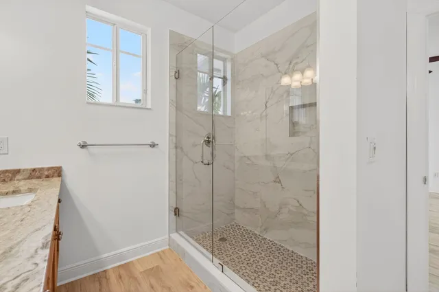 a bathroom with a double vanity sink and a mirror