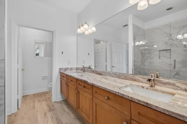 a view of an empty room with a ceiling fan