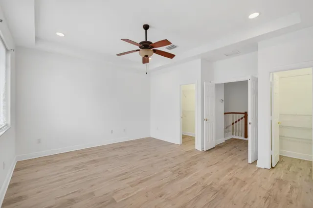 a dining room with furniture and a window