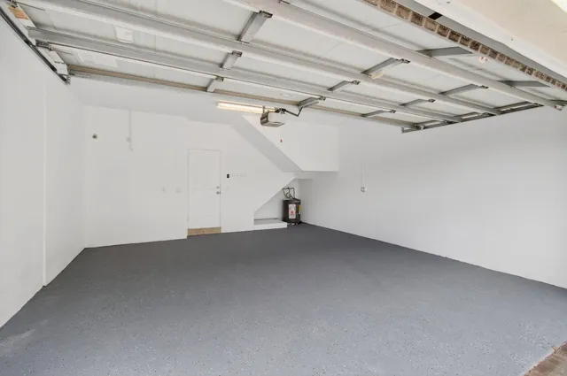 a bathroom with a granite countertop sink a toilet and a mirror