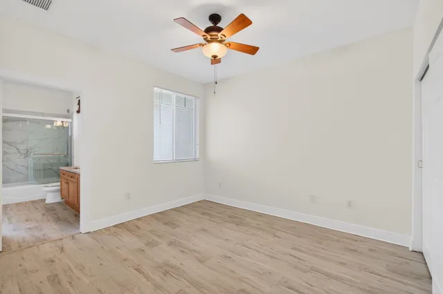 a view of a hallway with staircase