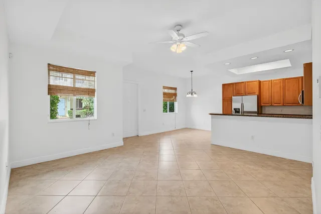 a kitchen with a stove a sink and a refrigerator