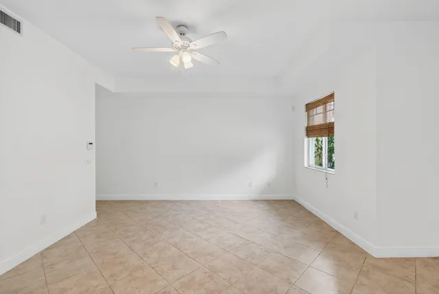 a view of a hallway with wooden floor and entryway