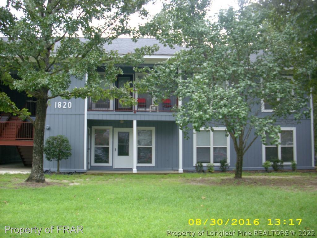 1820-2 Sardonyx Road Fayetteville, NC 28303 - Photo 1 of 21 front view of a building with a garden