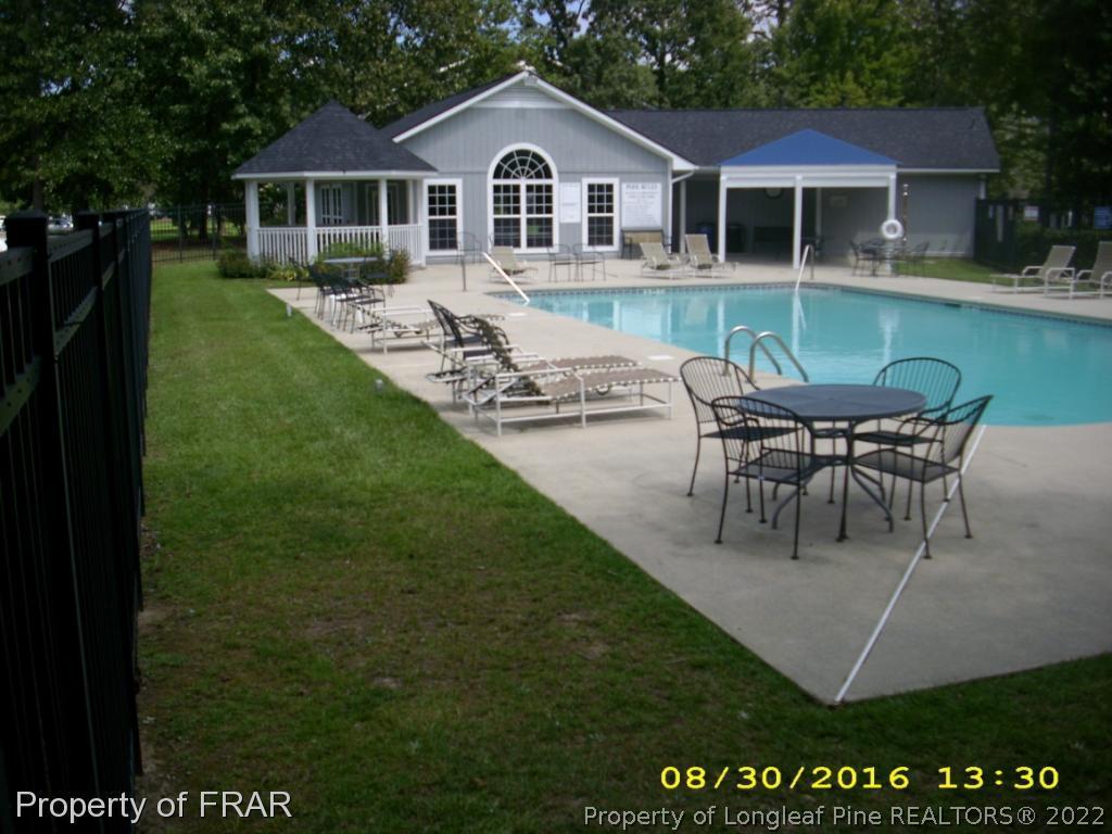 1820-2 Sardonyx Road Fayetteville, NC 28303 - Photo 18 of 21 a view of house with a yard chairs and table