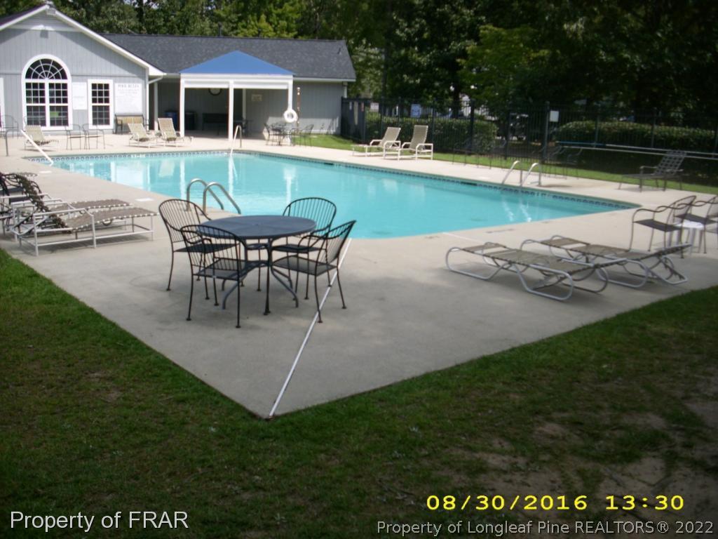 1820-2 Sardonyx Road Fayetteville, NC 28303 - Photo 19 of 21 a view of a house with pool and a yard