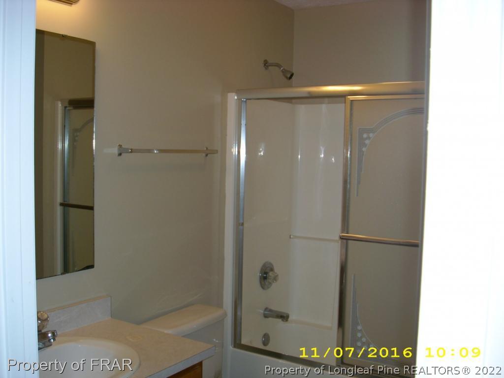 1820-2 Sardonyx Road Fayetteville, NC 28303 - Photo 7 of 21 a bathroom with a glass shower door