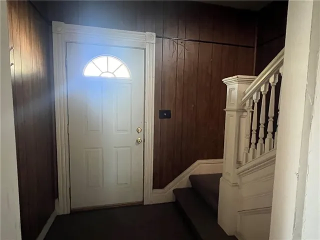 a view of hallway with shower and door