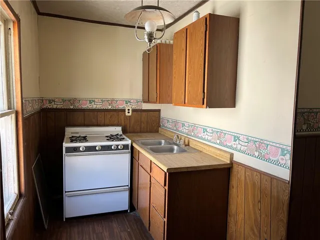 a bathroom with a glass door shower and a sink