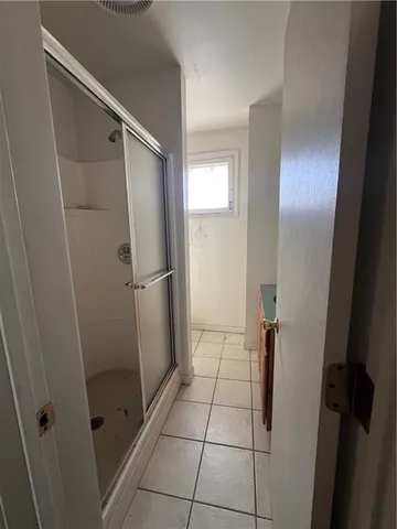 a white toilet sitting next to a window