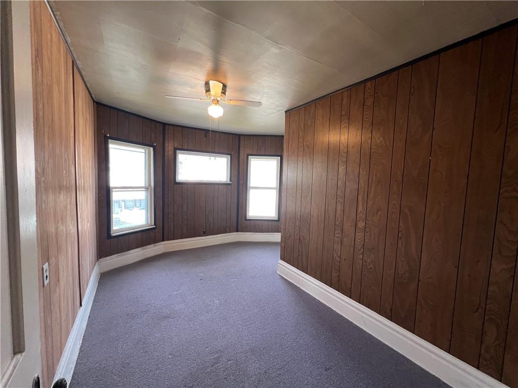 120 Jefferson Avenue Sharon, PA 16146 - Photo 28 of 33 an empty room with windows and chandelier fan