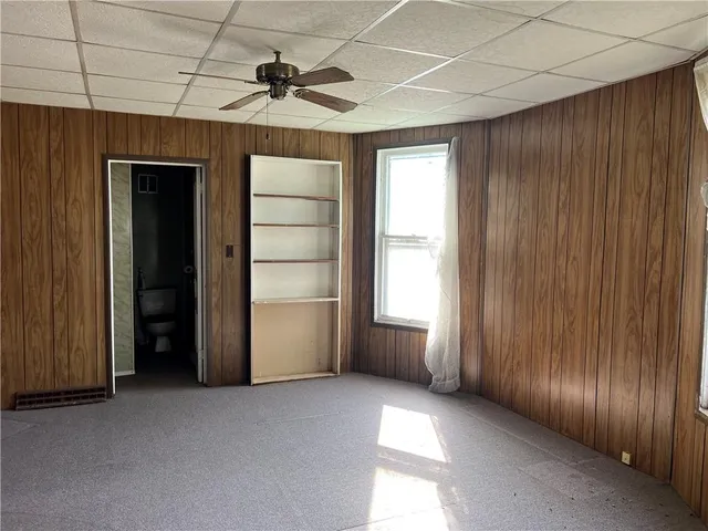 a view of an empty room with a fireplace