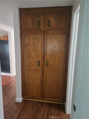 an empty room with wooden floor