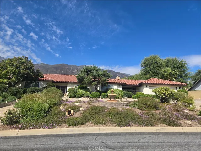 a backyard of a house with yard and outdoor seating