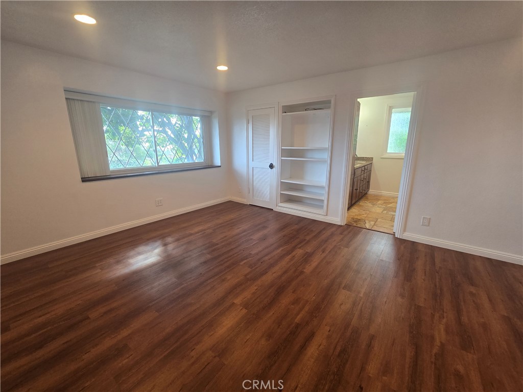 9388 Valley View Street Rancho Cucamonga, CA 91737 - Photo 23 of 40 wooden floor in an empty room with a window